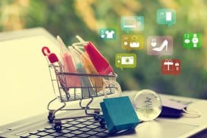 Crafting a compelling product description in WooCommerce. A shopping cart overflowing with colourful products and text emphasizes the importance of well-written descriptions for online stores.