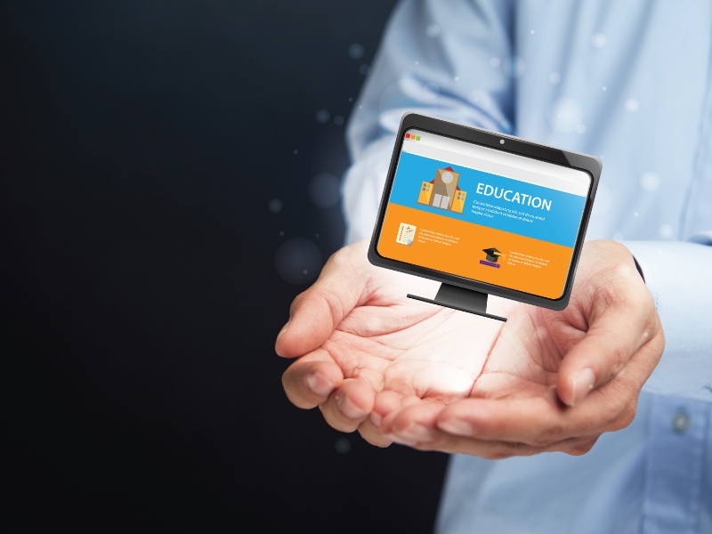 Innovative digital design concept showing the best websites for schools on a virtual screen in a person’s hands.