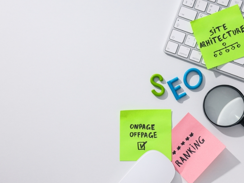 SEO strategy for distributor website design with sticky notes and keyboard.