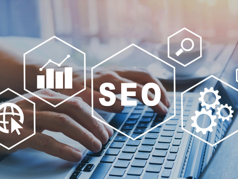 SEO strategies for best accounting website design with icons and hands typing on laptop