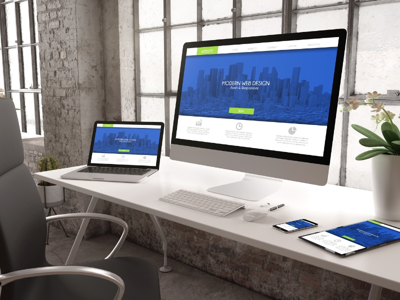 Custom website design packages displayed on desktop, laptop, tablet, and smartphone showing responsive web layout.