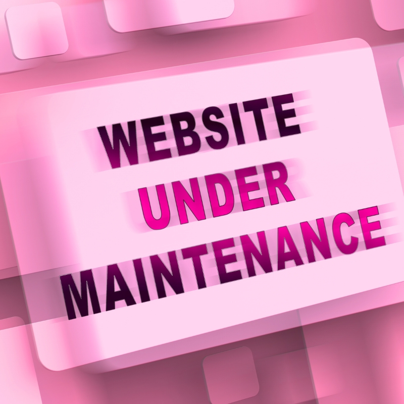 A pink 3D block displaying the words "WEBSITE UNDER MAINTENANCE" representing ongoing website development updates.